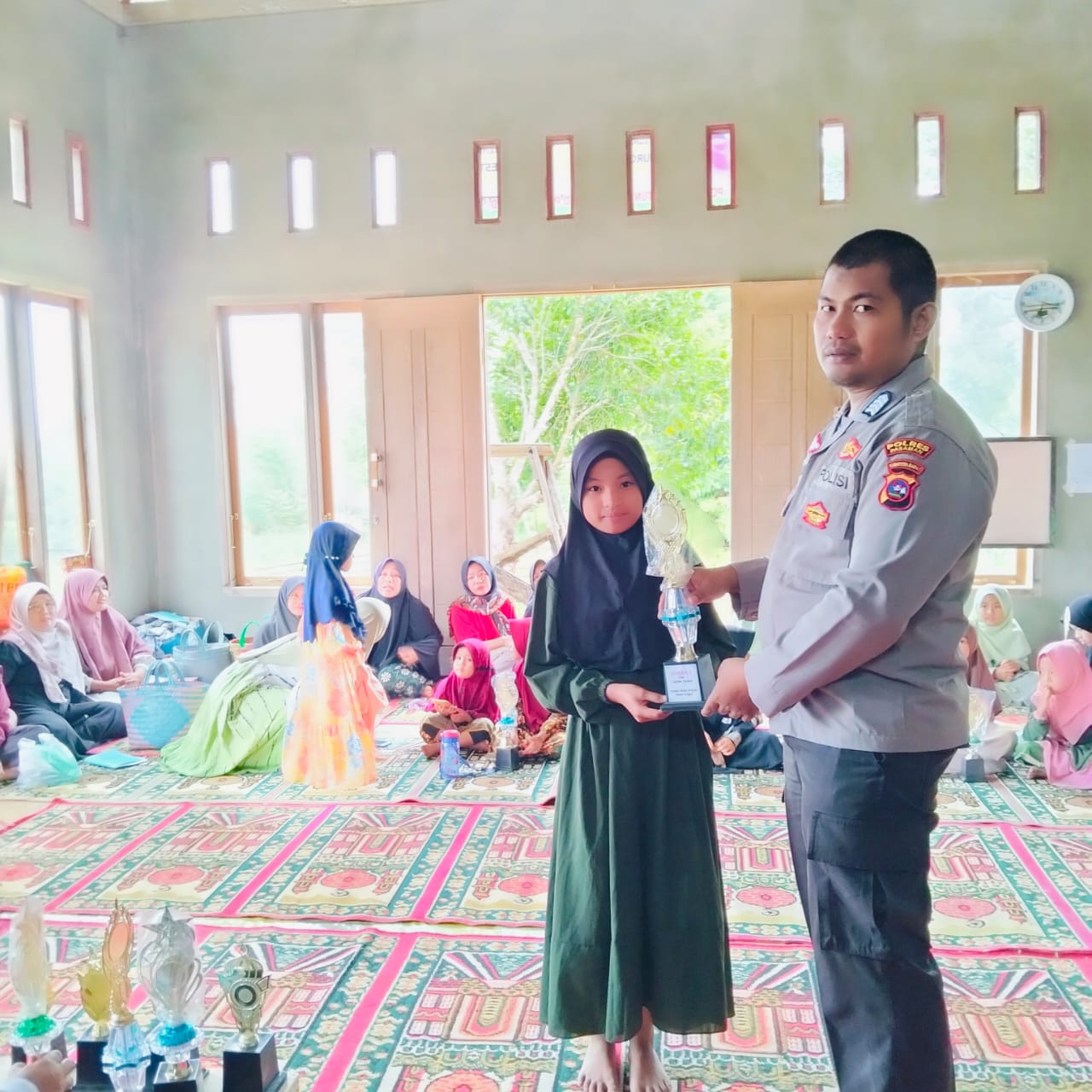Kapolsek Mapat Tunggul  Menghadiri Perlombahaan Tahfidz Tingkat Anak anak 